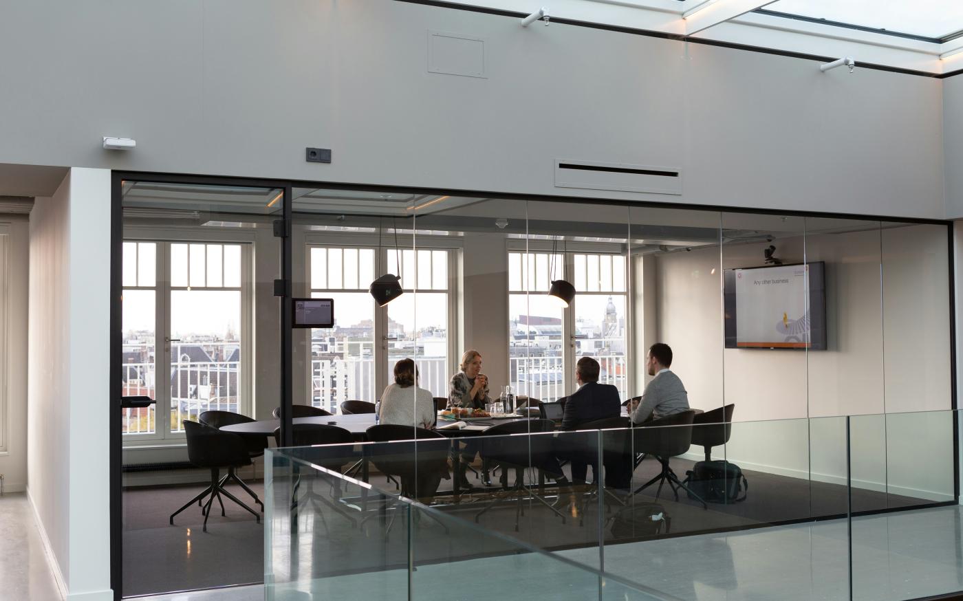 people sitting on chair inside building by Rodeo Project Management Software courtesy of Unsplash.