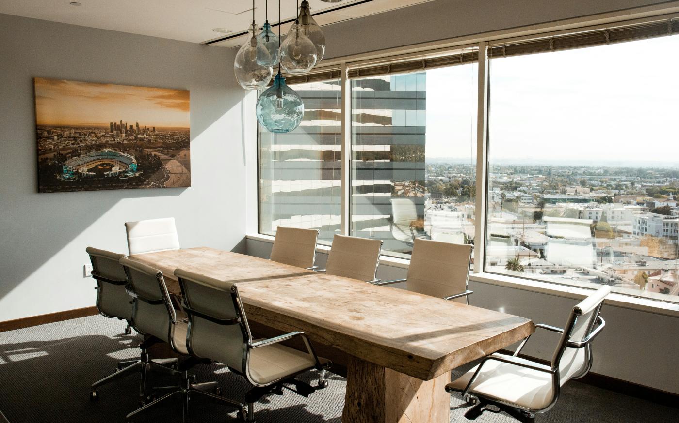 beige wooden conference table by Dane Deaner courtesy of Unsplash.