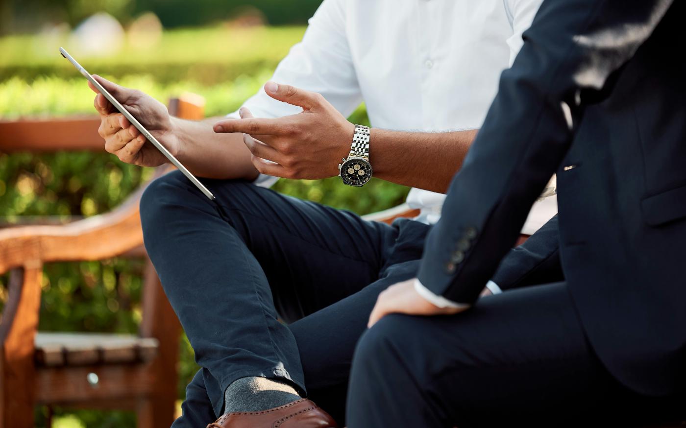 two people sitting during day by Medienstürmer courtesy of Unsplash.