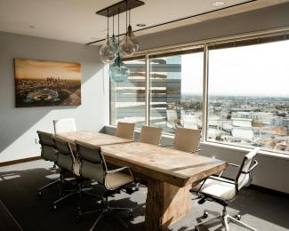 beige wooden conference table by Dane Deaner courtesy of Unsplash.